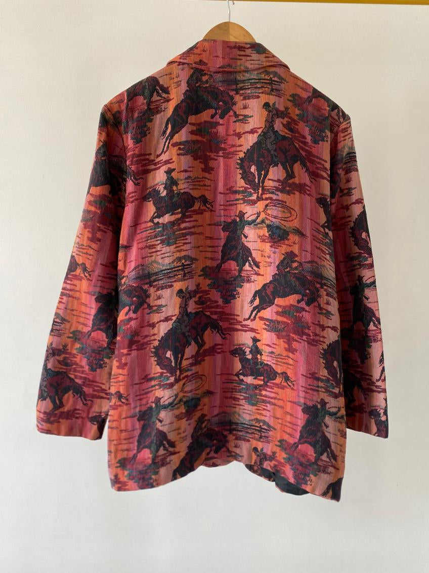 Flannel shirt with cowboy pattern on a white wall